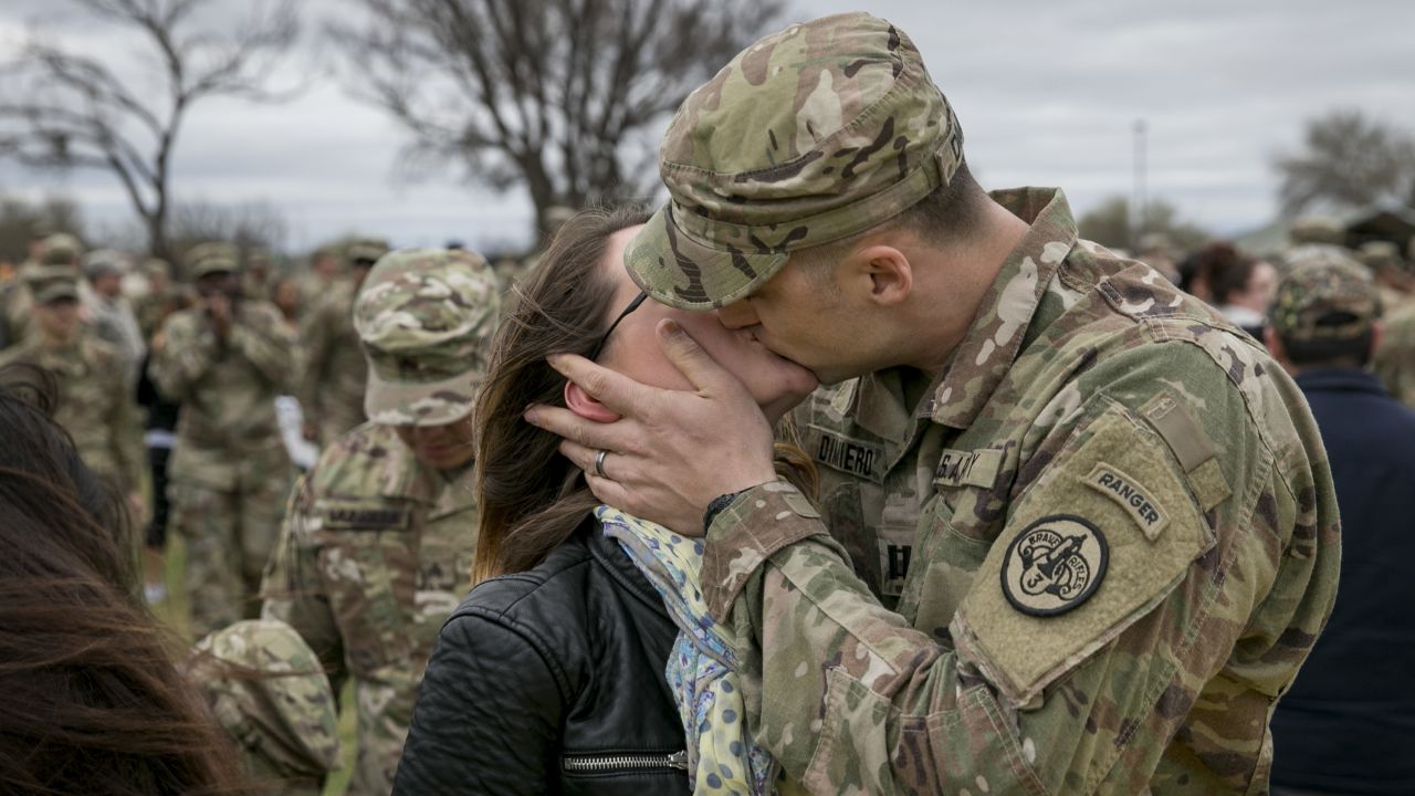 Army Capt. Thomas DiMiero kisses his wife, Jennifer, during a welcome-home ceremony in Fort Hood, Texas, on Tuesday, February 14. He had just returned from Afghanistan with other soldiers from the 3rd Cavalry Regiment.