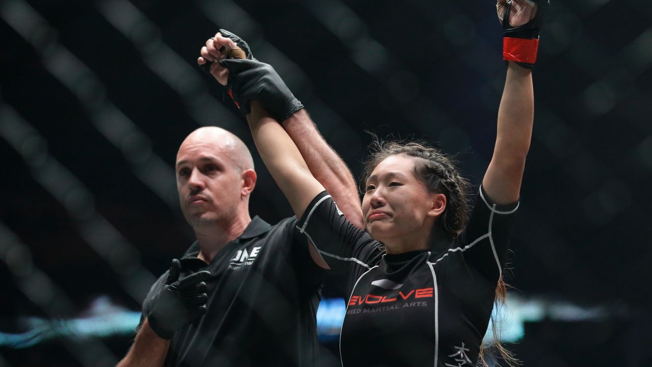Angela Lee celebrates after defeating Natalie Gonzales Hills of Philippines in the Women's Strawweight bout during the One Nation Pride of Lions in Singapore. Photo: Suhaimi Abdullah/Getty Images