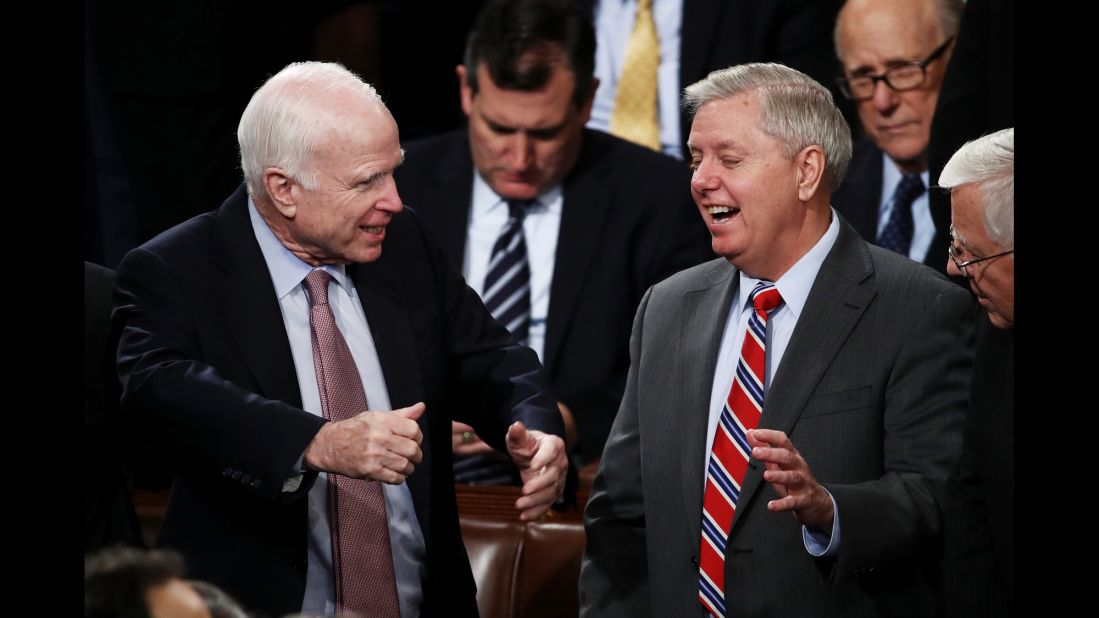 US Sen. John McCain, left, talks with US Sen. Lindsey Graham before Trump arrived.