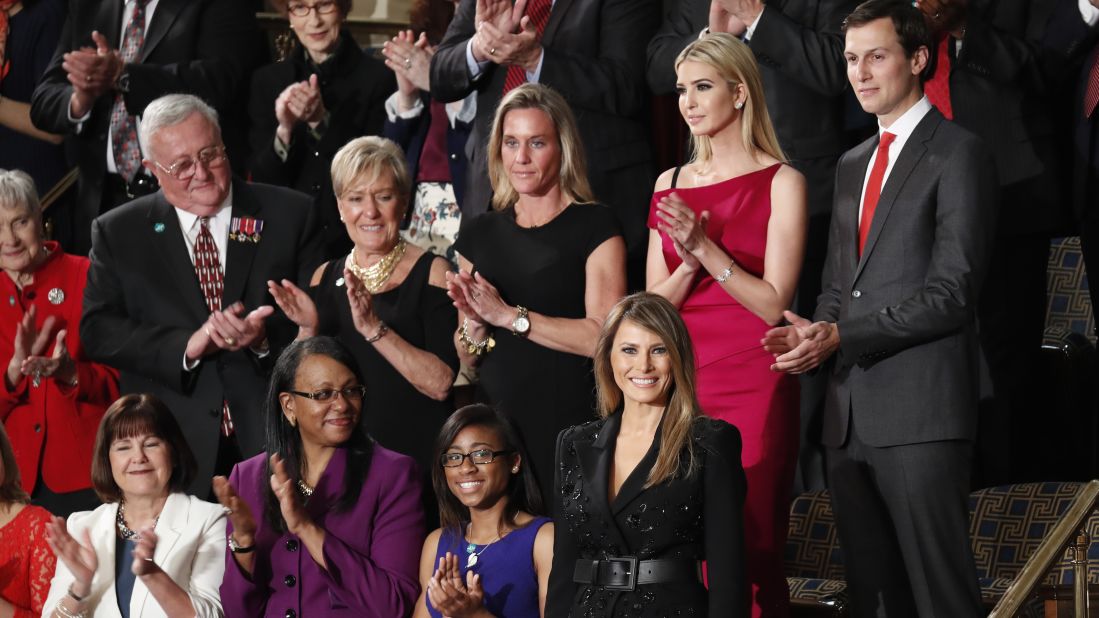 First lady Melania Trump, bottom right, is applauded as she arrives in the chamber.