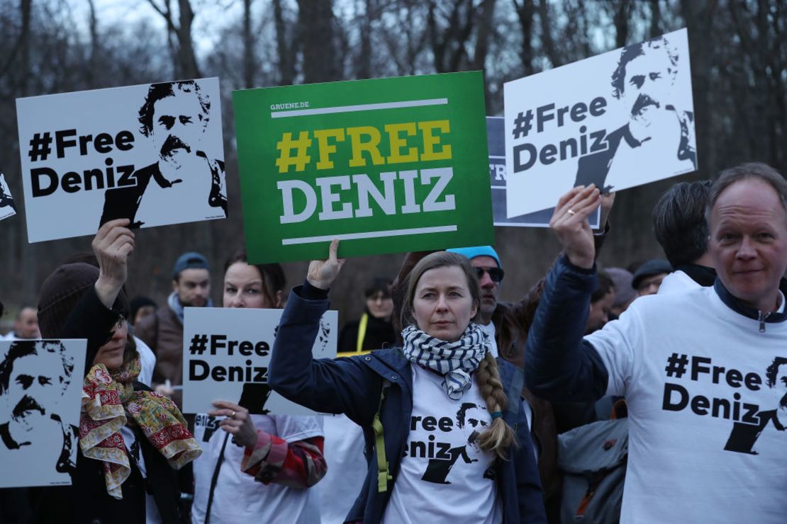 Protesters gather outside the Turkish Embassy in Berlin on Tuesday to demand Yucel's release.