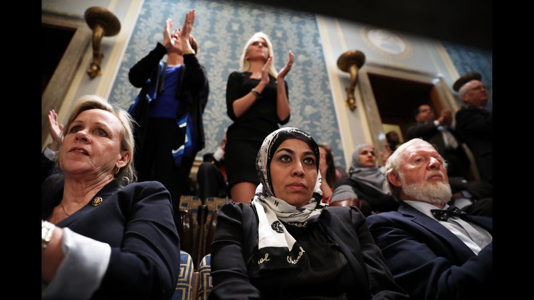 Muslim activist Fauzia Rizvi, a guest of US Rep. Mark Takano, watches Trump's address.