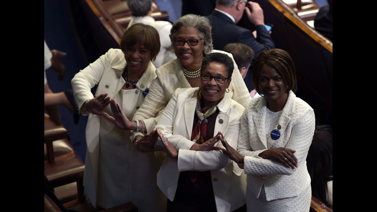 Many Democrats wore white as a nod to the women's suffrage movement. Posing for a photo here are, from left, US Reps. Brenda Lawrence, Joyce Beatty, Marcia Fudge and Val Demings.
