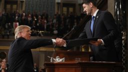 U.S. President Donald J. Trump (L) shakes hands with Speaker of the House Paul Ryan (R) as he arrives to deliver an address to a joint session of the U.S. Congress on February 28, 2017 in the House chamber of the U.S. Capitol in Washington, DC. 