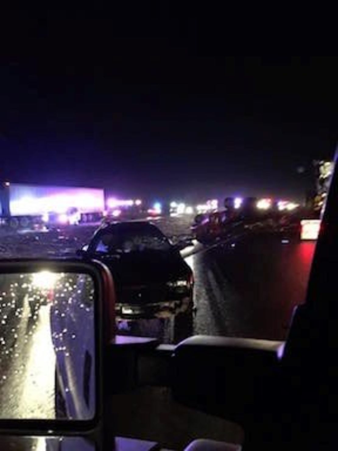 Vehicles are left mangled along and near Interstate 55 in eastern Missouri.