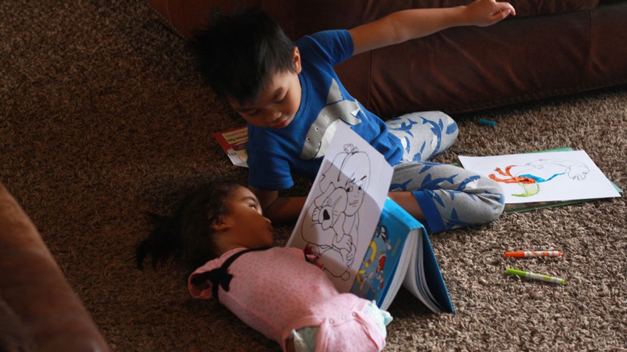 Maria plays with her brother, who was also adopted from the Philippines. 