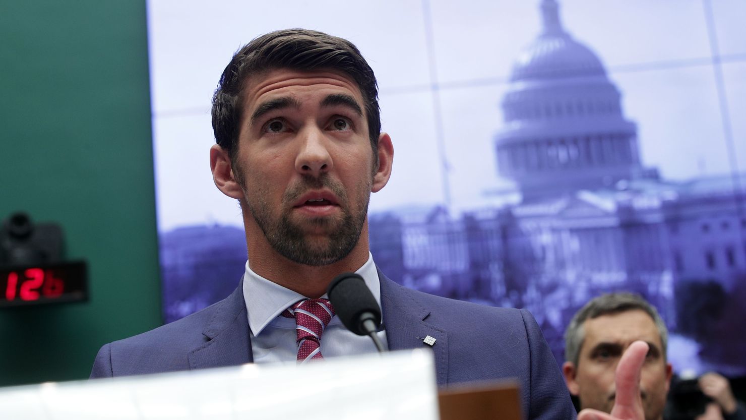 Retired American swimmer Michael Phelps testifies during a hearing before the Oversight and Investigations Subcommittee of House Energy and Commerce Committee 