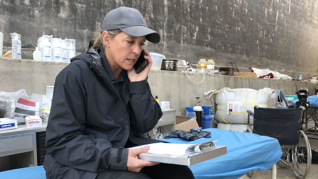 Kathy Bequary, NYC Medic' country director, coordinates transfer of a patient to Baghdad.