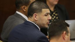 Former New England Patriots tight end Aaron Hernandez sits with his attorneys Jose Baez, right, and Ronald Sullivan, left, at the opening of the fist day of his double murder trial at Suffolk Superior Court on Wednesday, March 1, 2017, in Boston. Hernandez is standing trial for the July 2012 killings of Daniel de Abreu and Safiro Furtado who he encountered in a Boston nightclub. He is already serving a life sentence in the 2013 killing of semi-professional football player Odin Lloyd. (AP Photo/Stephan Savoia, Pool)