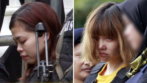 Police escort two women charged in the case -- Siti Aisyah, left, and Doan Thi Huong -- on  March 1.