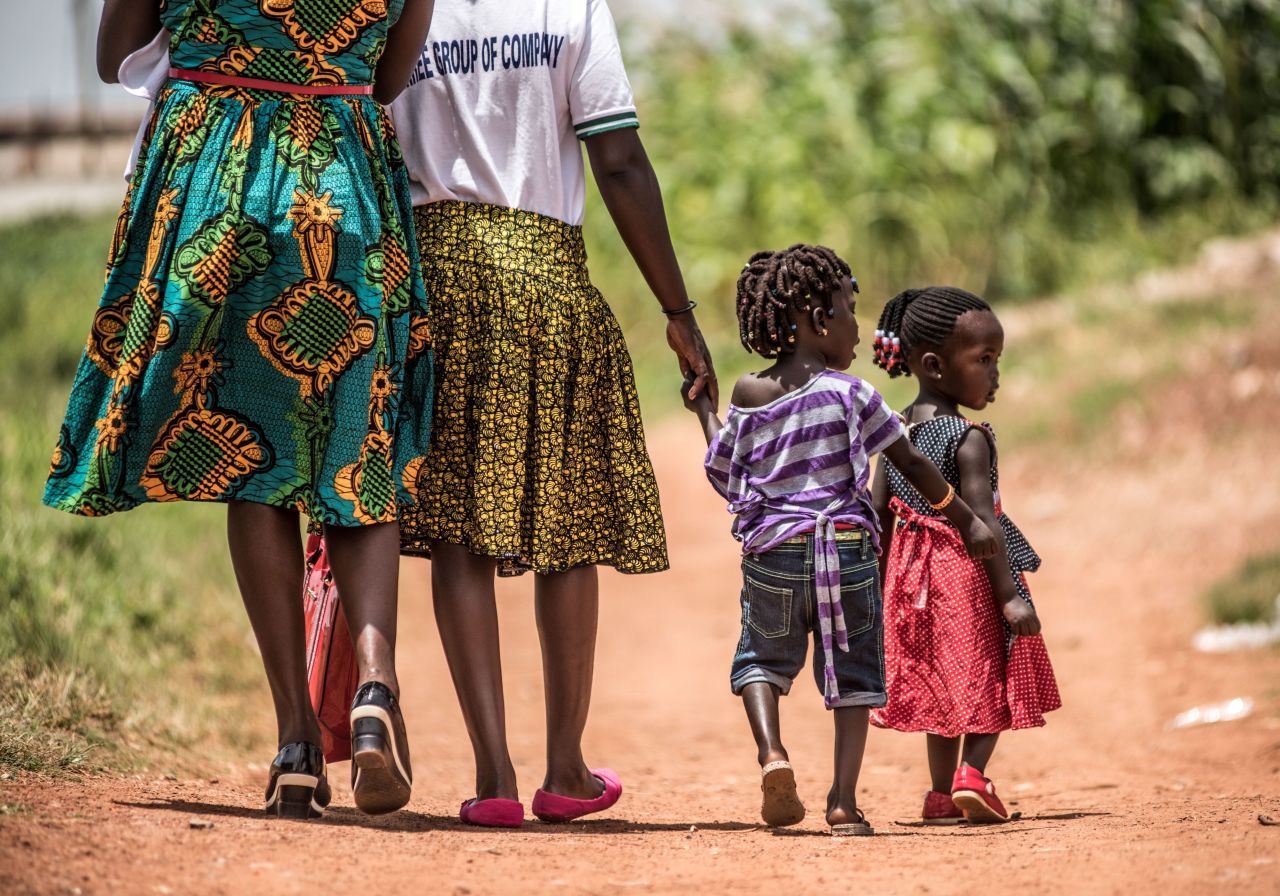 Clients walk home after a visit to the clinic. Over one in ten women of reproductive age in Uganda die during childbirth, according to International Planned Parenthood Federation. 
