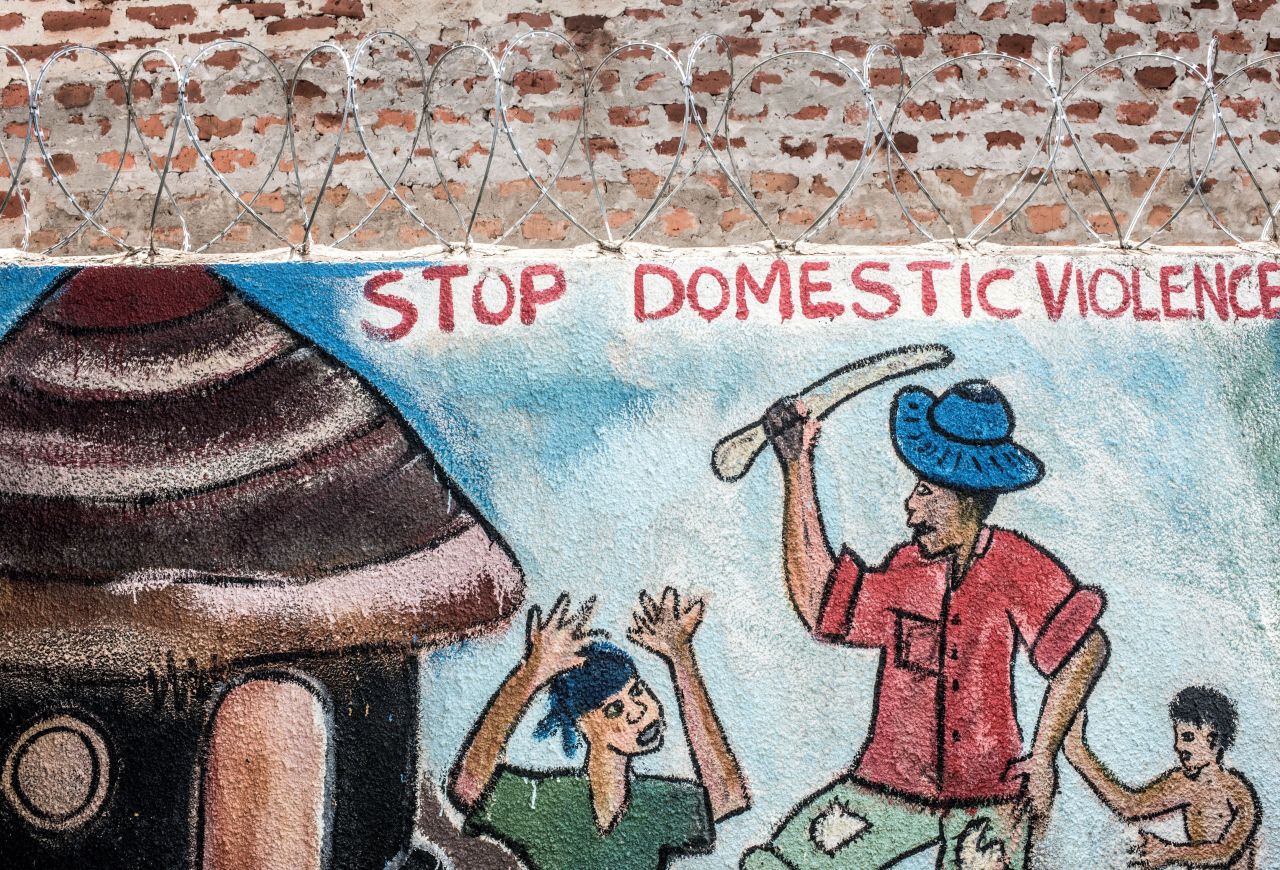 A mural at a clinic in Uganda highlights domestic violence issues. Organizations like RHU and Marie Stopes Uganda say they aim to provide a variety of sexual health and family planning services. 