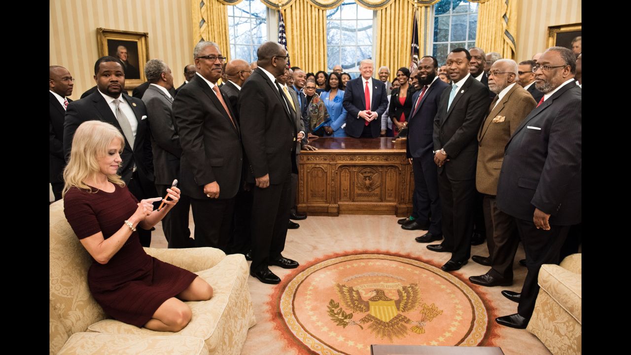 White House Adviser Kellyanne Conway checks her phone after taking an Oval Office photo of President Trump and leaders of historically black colleges and universities on Monday, February 27. The image of her kneeling on the couch <a href="http://www.cnn.com/videos/politics/2017/02/28/kellyanne-conway-oval-couch-photo-orig-vstan.cnn" target="_blank">sparked memes on social media.</a>
