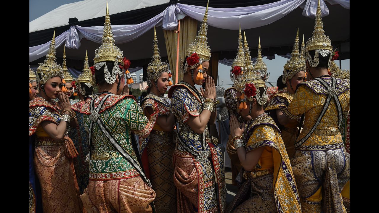 Traditional Thai dancers wait to perform at a religious ceremony marking the construction of the late king's funeral pyre on Monday, February 27. King Bhumibol Adulyadej, a revered figure who helped unify the nation in his 70-year reign, <a href="http://www.cnn.com/2016/10/13/asia/thai-king-bhumibol-adulyadej-dies/" target="_blank">died last year</a> at the age of 88.