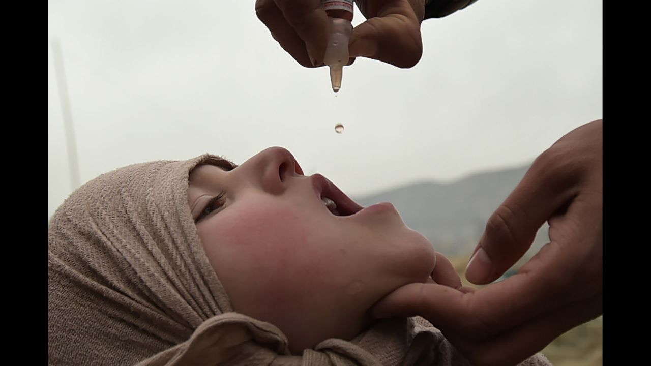 A health worker administers the polio vaccine to a child in Kabul, Afghanistan, on Tuesday, February 28. Polio, once a worldwide scourge, is endemic in just three countries now: Afghanistan, Nigeria and Pakistan.