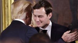 US President Donald Trump (L) congratulates his son-in-law and senior advisor Jared Kushner after the swearing-in of senior staff in the East Room of the White House on January 22, 2017 in Washington, DC. / AFP / MANDEL NGAN        (Photo credit should read MANDEL NGAN/AFP/Getty Images)