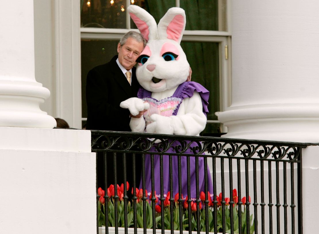 Bush embraces a person dressed as the Easter bunny during the annual Easter Egg Roll on March 24, 2008.