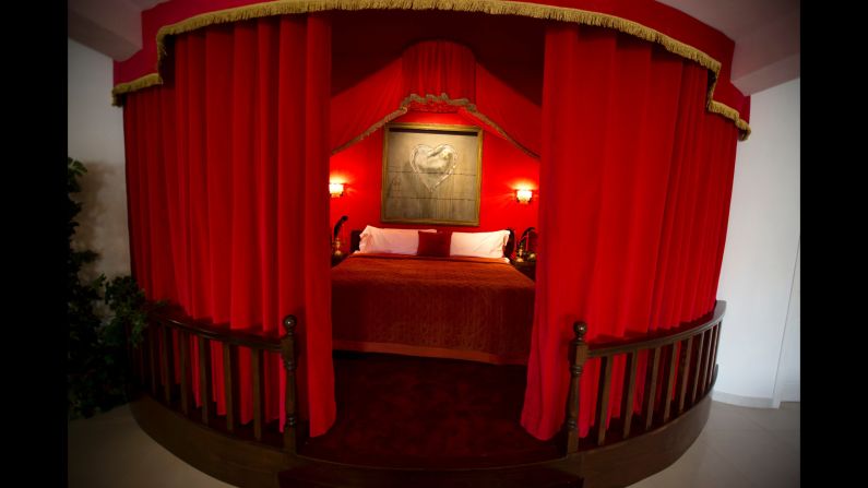 The presidential suite features a striking feature bed and is, according to the website, "equipped with everything a corrupt head of state would need." 