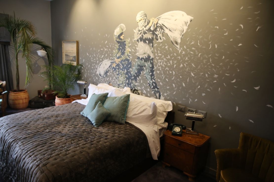 A Banksy wall mural in one of the guest rooms of the hotel
