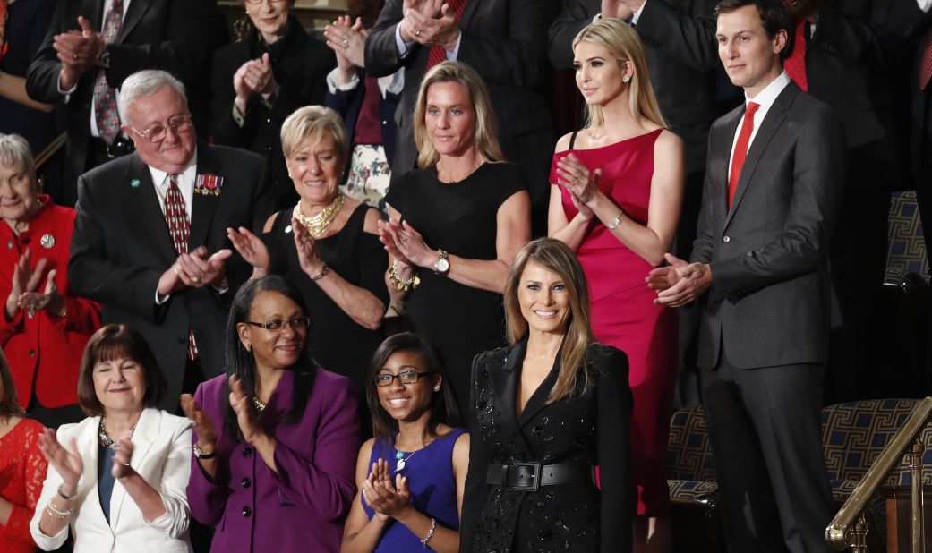 First lady Melania Trump, bottom right, is applauded as she arrives in the House chamber for her husband's speech.