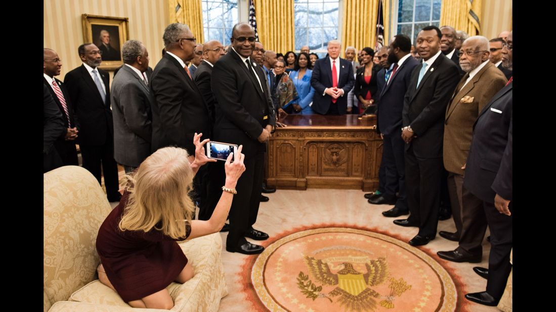 White House Adviser Kellyanne Conway takes an Oval Office photo of President Trump and leaders of historically black colleges and universities on Monday, February 27. The image of her kneeling on the couch <a href="http://www.cnn.com/videos/politics/2017/02/28/kellyanne-conway-oval-couch-photo-orig-vstan.cnn" target="_blank">sparked memes on social media.</a>