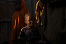A young Somali boy grieves for his mother, who had died in a camp for displaced people