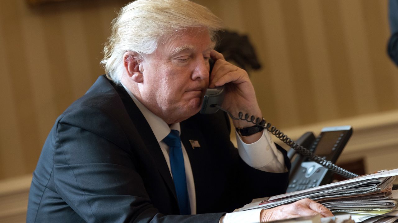 WASHINGTON, DC - JANUARY 28: President Donald Trump speaks on the phone with Russian President Vladimir Putin in the Oval Office of the White House, January 28, 2017 in Washington, DC. On Saturday, President Trump is making several phone calls with world leaders from Japan, Germany, Russia, France and Australia. (Photo by Drew Angerer/Getty Images)