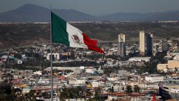 TIJUANA, MEXICO - JANUARY 26:  A large Mexican flag flies over the city on January 26, 2017 in Tijuana, Mexico.  U.S. President Donald Trump announced a proposal to impose a 20 percent tax on all imported goods from Mexico to pay for the border wall between the United States and Mexico. Mexican President Enrique Pea Nieto canceled a planned meeting with President Trump over who would pay for Trump's campaign promise to build a border wall.  (Photo by Justin Sullivan/Getty Images)