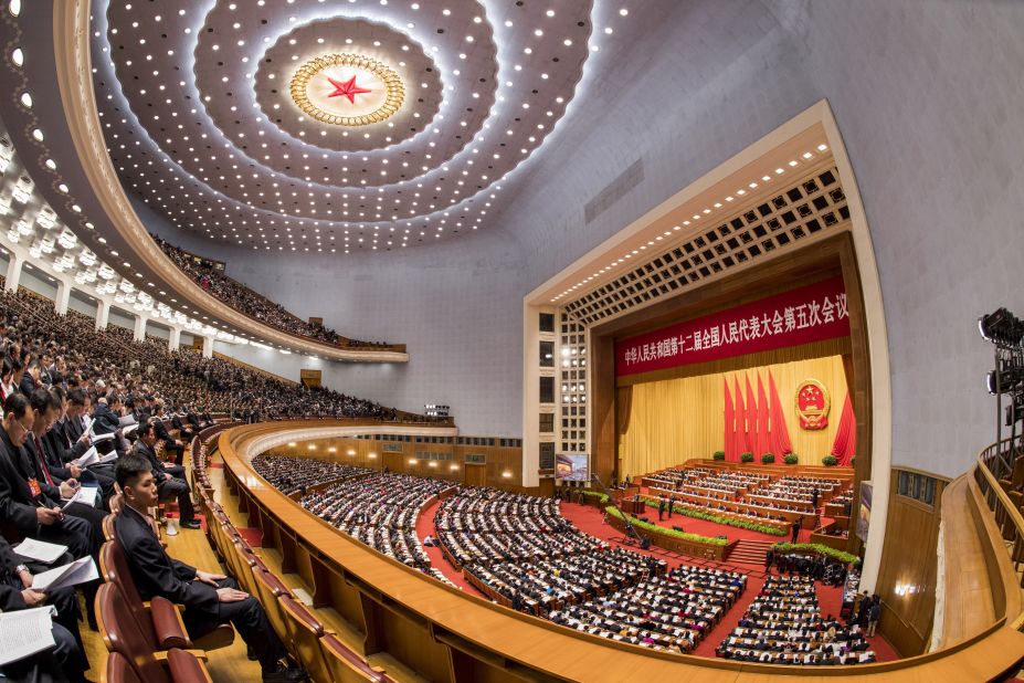  Delegates attend the opening ceremony.