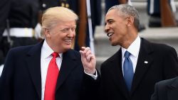US President Donald Trump and former President Barack Obama talk on the East front steps of the US Capitol after inauguration ceremonies on January 20, 2017 in Washington, DC.