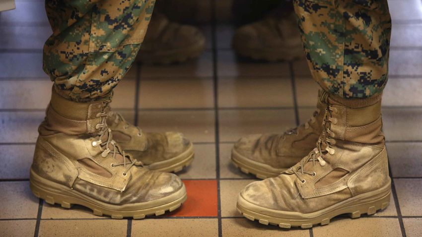 PARRIS ISLAND, SC - FEBRUARY 26:  Female Marine recruits sit with their feet at a 45 degree angle, the same angle they are at while standing at the position of attention, while having lunch during boot camp on February 26, 2013 at MCRD Parris Island, South Carolina. Female enlisted Marines have gone through recruit training at the base since 1949. About 11 percent of female recruits who arrive at the boot camp fail to complete the training, which can be physically and mentally demanding. On January 24, 2013 Secretary of Defense Leon Panetta rescinded an order, which had been in place since 1994, that restricted women from being attached to ground combat units.  (Photo by Scott Olson/Getty Images)