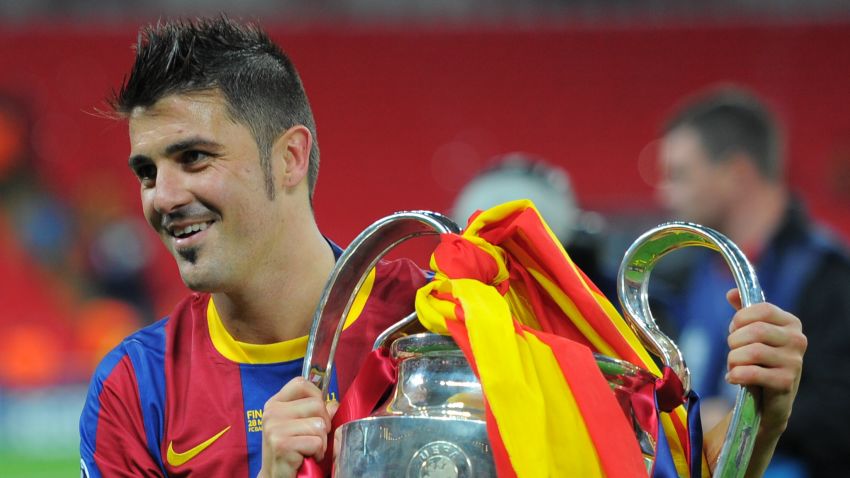 Barcelona's Spanish forward David Villa celebrates with the trophy at the end of the UEFA Champions League final football match FC Barcelona vs. Manchester United, on May 28, 2011 at Wembley stadium in London.Barcelona won 3 to 1. AFP PHOTO / LLUIS GENE (Photo credit should read LLUIS GENE/AFP/Getty Images)
