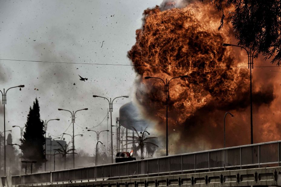 Flames billow from an explosion in Mosul during a clash between Iraqi forces and ISIS fighters on Sunday, March 5.