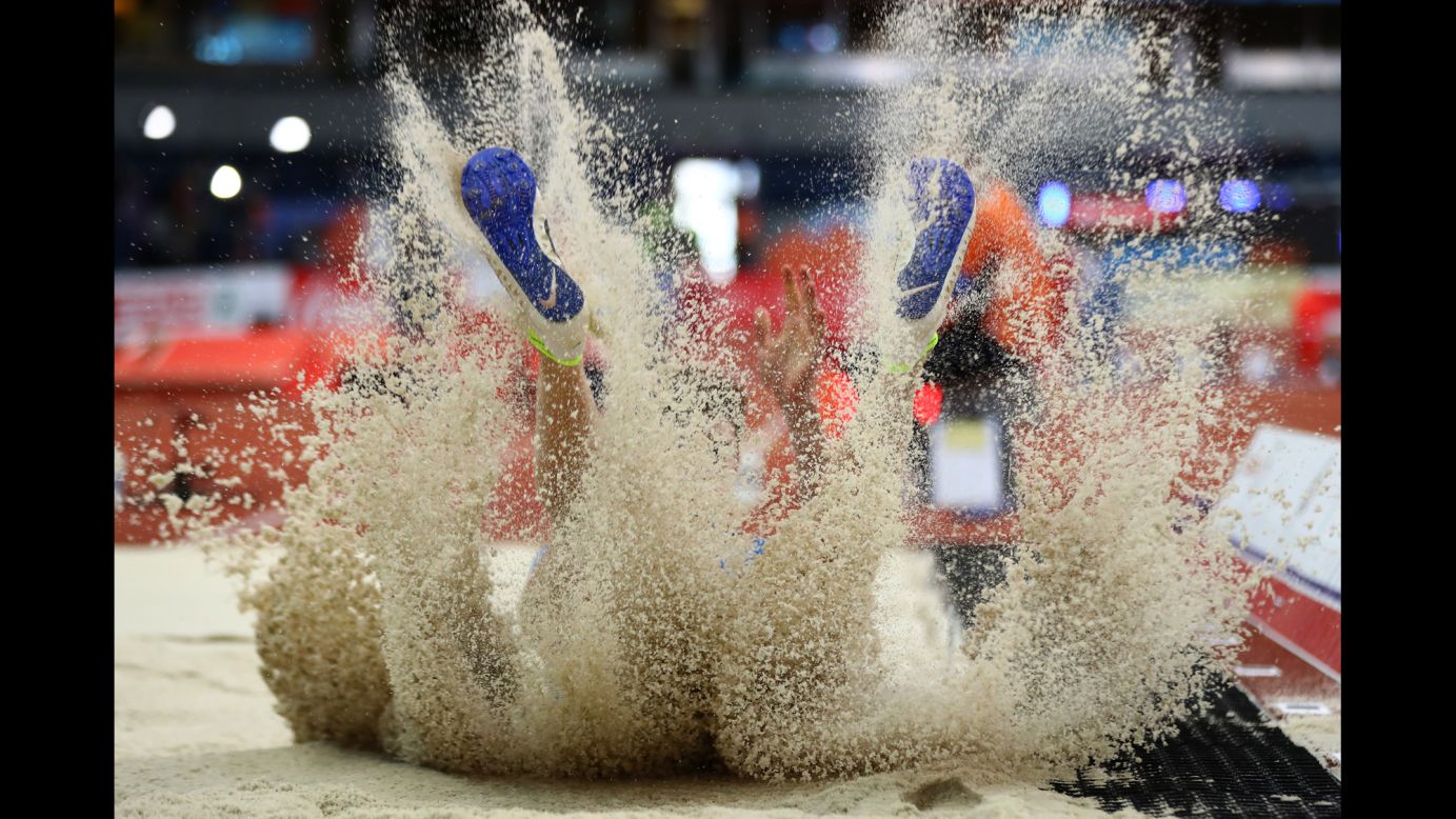 Italian long jumper Filippo Randazzo lands in the pit Friday, March 3, at the European Indoor Championships.