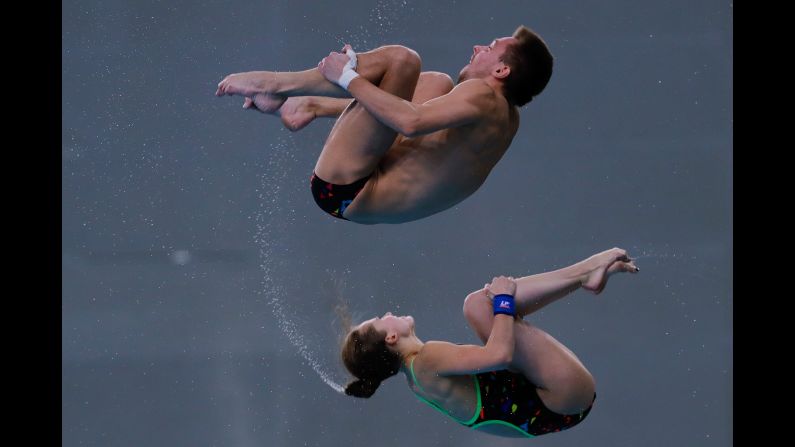 Yulia Timoshinina and Viktor Minibaev, synchronized divers from Russia, compete during the Diving World Series event in Beijing on Sunday, March 5. They finished second in the 10-meter platform.