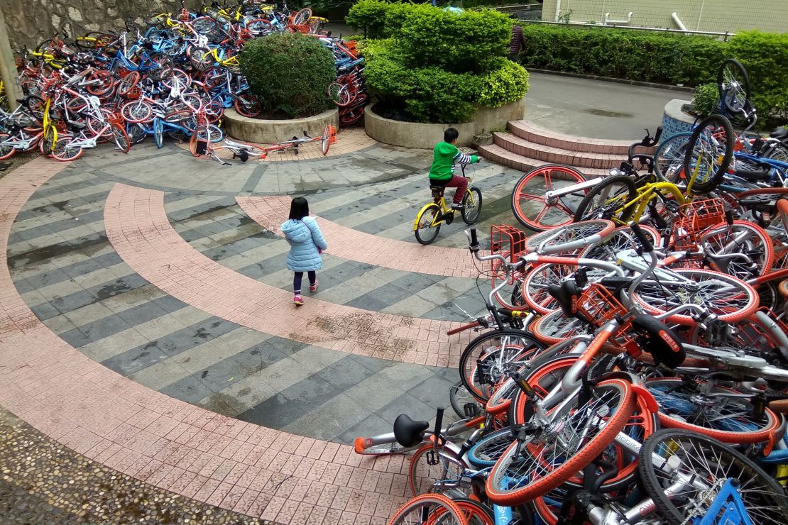 This picture taken on January 16, 2017 shows rented bicycles from bike-sharing schemes in Shenzhen.          