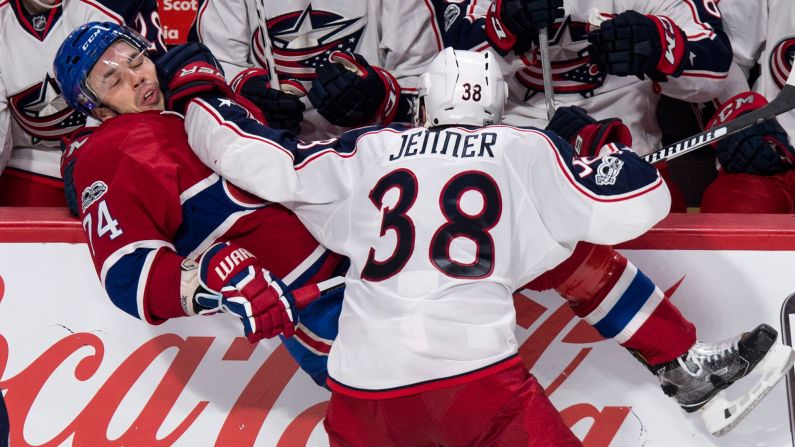 Columbus' Boone Jenner checks Montreal's Alexei Emelin during an NHL hockey game on Tuesday, February 28.