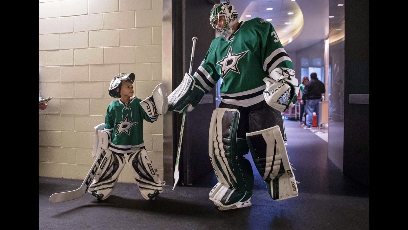 Dallas goalie Kari Lehtonen greets 6-year-old Zavier Green before an NHL hockey game on Thursday, March 2.