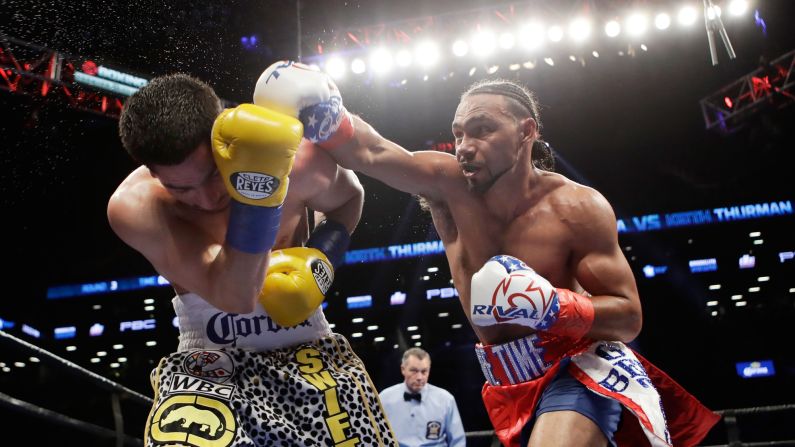 Keith Thurman punches Danny Garcia during their welterweight title fight in New York on Saturday, March 4. Thurman won by split decision.