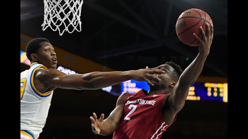 Washington State guard Ike Iroegbu is hit in the face by UCLA's Ike Anigbogu during a Pac-12 basketball game on Saturday, March 4.