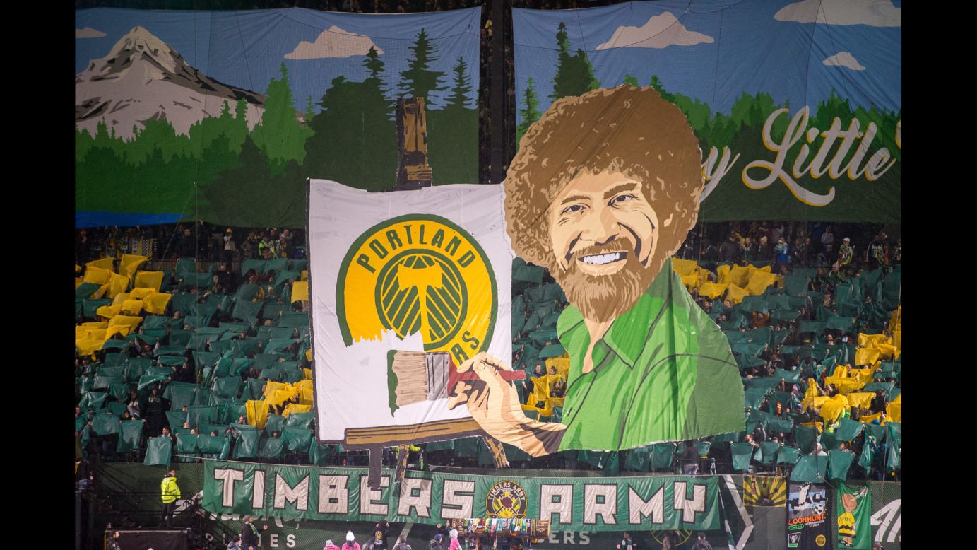 Fans of the Portland Timbers unveil a tifo of famous painter Bob Ross before the MLS season opener on Friday, March 3. The theme was "Happy Little Trees" -- Ross' catchphrase and a play on the soccer team's name.