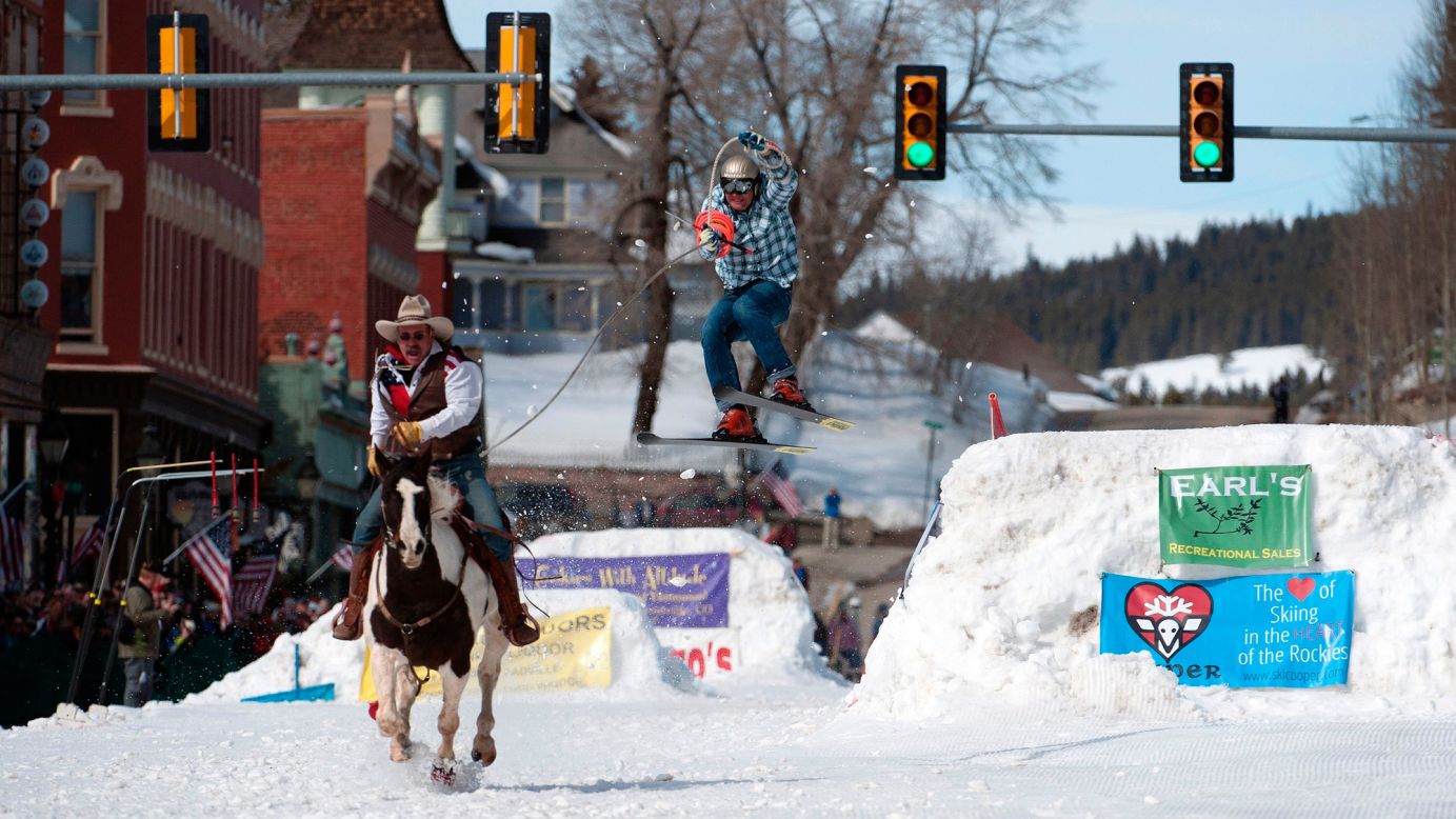 Jeff Dahl rides a horse to pull his son, Greg, during a skijoring competition in Leadville, Colorado, on Saturday, March 4. In skijoring, a skier navigates jumps and slalom gates while grabbing rings for points. Leadville has been hosting skijoring competitions since 1949.