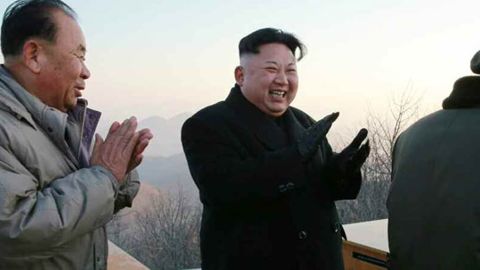North Korean leader Kim Jong Un applauds Monday's ballistic missile launch.