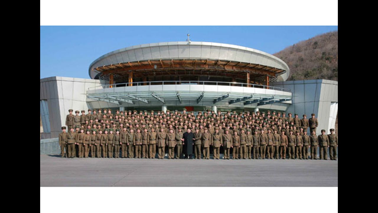 North Korean leader Kim Jong Un (C) stands with troops on March 6, according to state media.