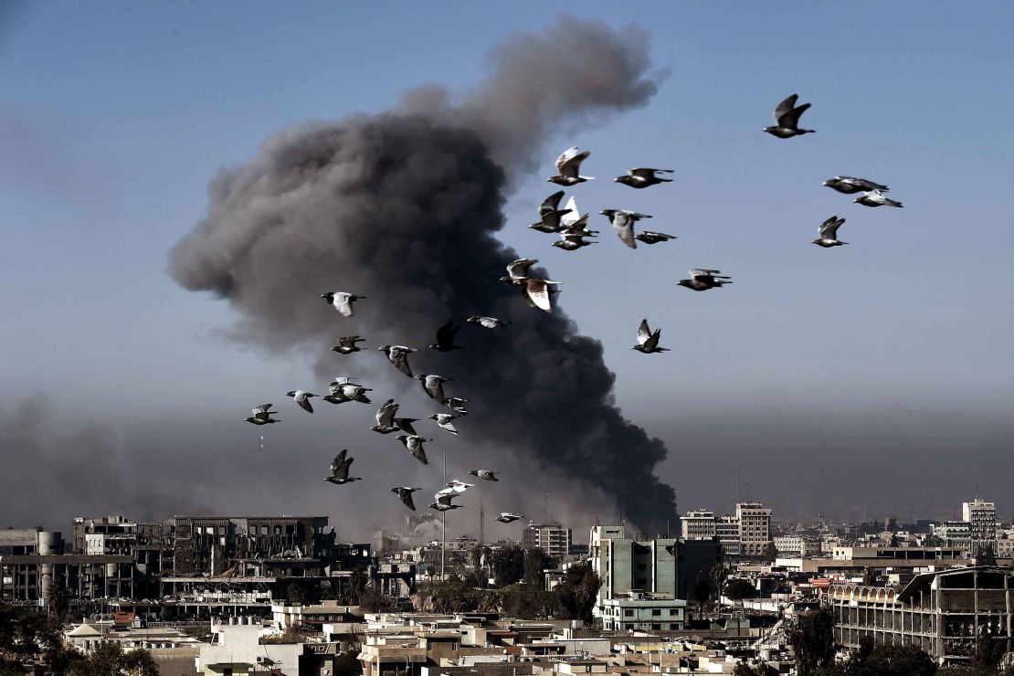 Smoke rises following an airstrike in western Mosul during the offensive Monday. 