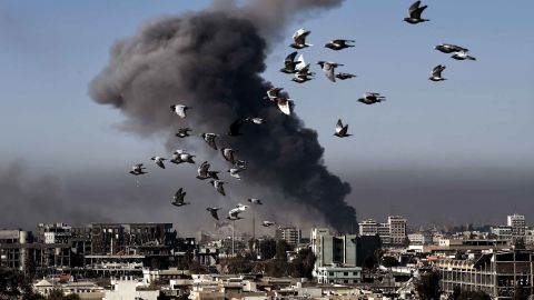 Smoke rises following an airstrike in western Mosul during the offensive Monday.