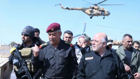 Iraqi Prime Minister Haidar al-Abadi, right, meets Iraqi forces in Mosul Tuesday.