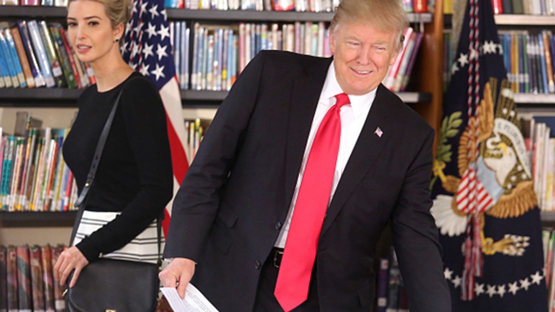 President Donald Trump arrives in the room with daughter Ivanka Trump for a roundtable discussion at St. Andrew Catholic School on March 3, 2017, in Orlando, Fla.