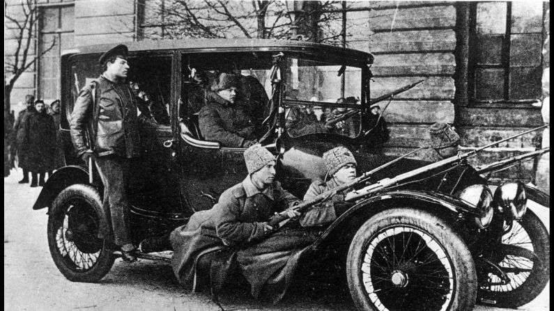 Armed revolutionary soldiers patrol Petrograd during the February Revolution.