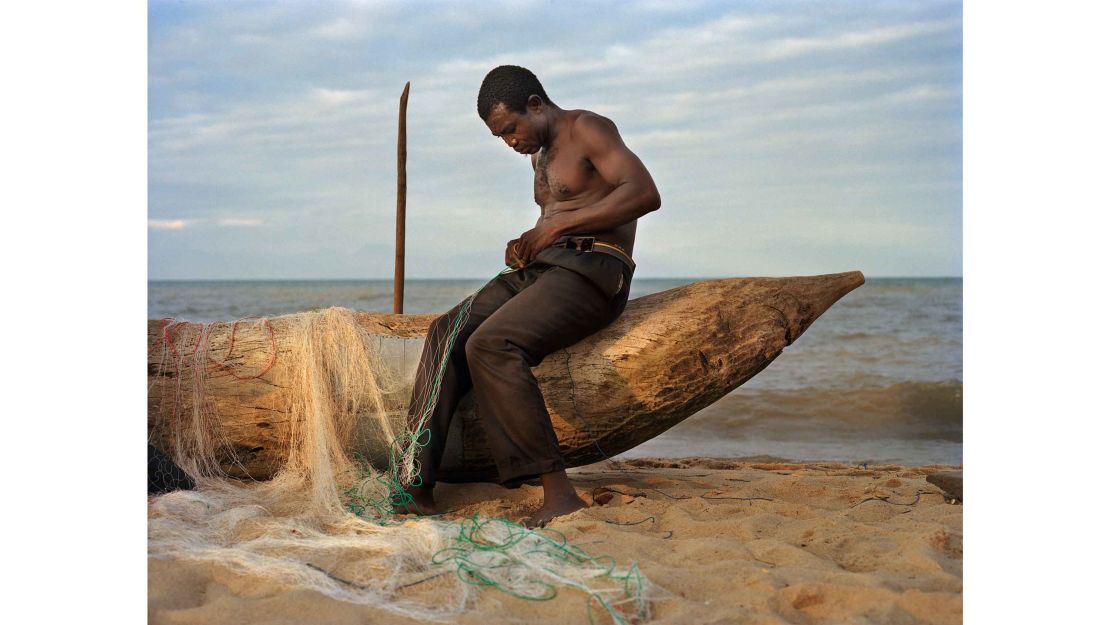 Fisherman Peter Chirwa, 45, prepares his nets in Ngosi Village, Malawi 